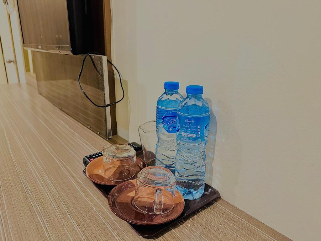 Cocoon Patong Hotel Stand room water bottles
